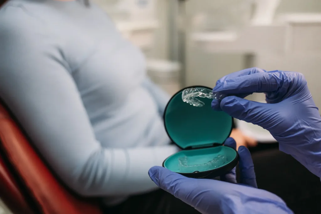 female patient getting invisalign treatment